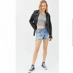 Levi’s x‎ Revolve 501’s High Rise Distressed Denim Shorts.