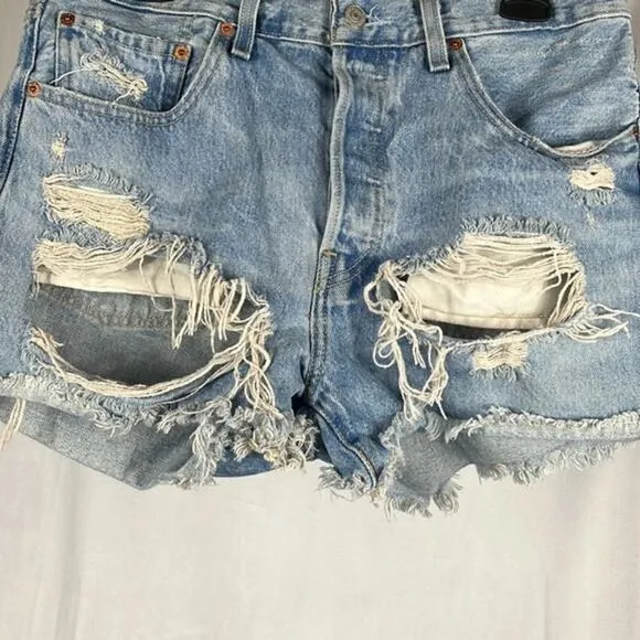 Levi’s x‎ Revolve 501’s High Rise Distressed Denim Shorts.
